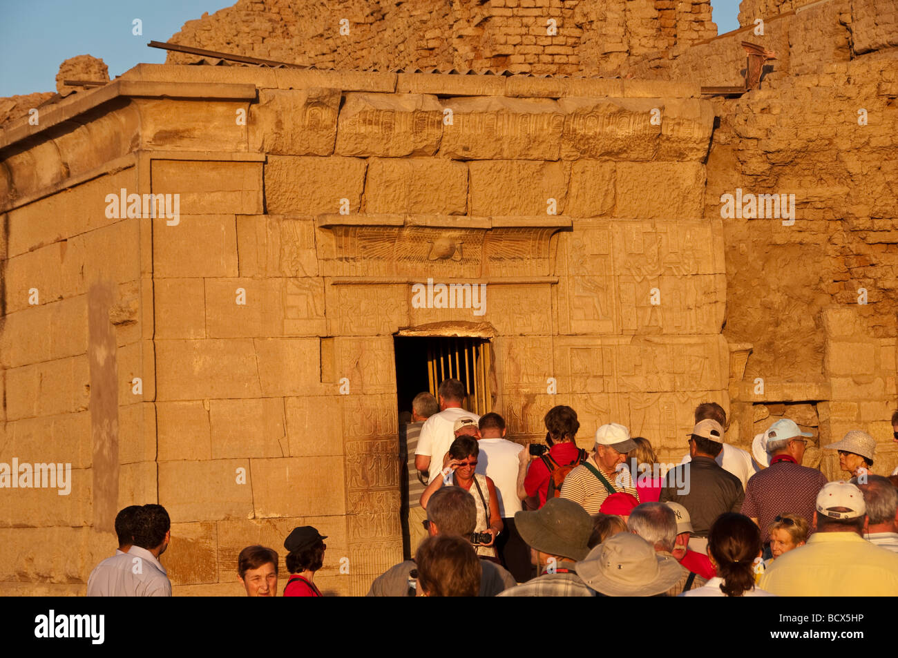 Egypt Kom Ombo temple tourists crowd into chapel where mummified crocodiles displayed Stock Photo