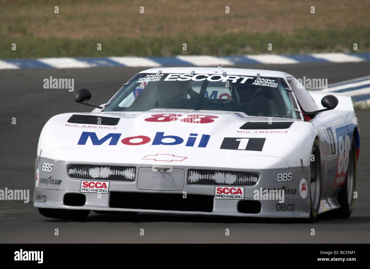 A 1988 Protofab Chevy Corvette participates in a vintage racing event. Stock Photo