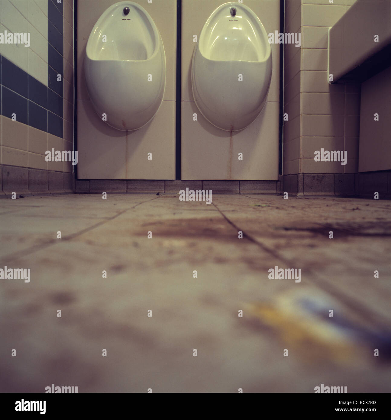 urinals in dirty bathroom Stock Photo Alamy