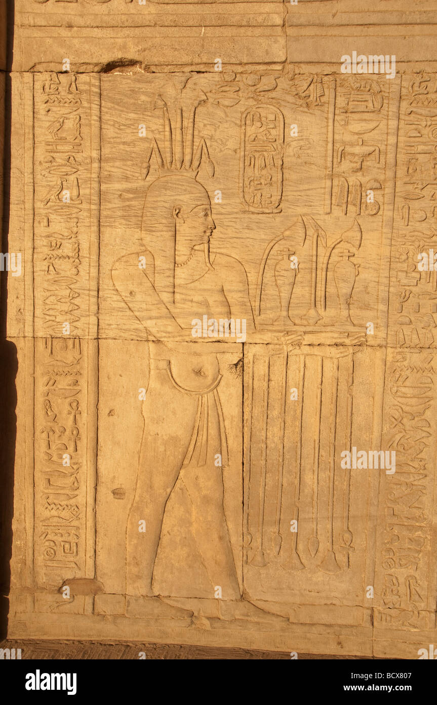 Egypt Kom Ombo temple hieroglyph carving relief pharaoh wearing crown Stock Photo