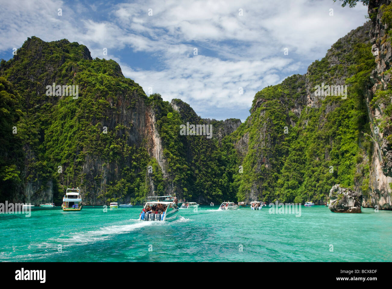 Tourist boats in Ko Phi Phi Leh, Thailand Stock Photo