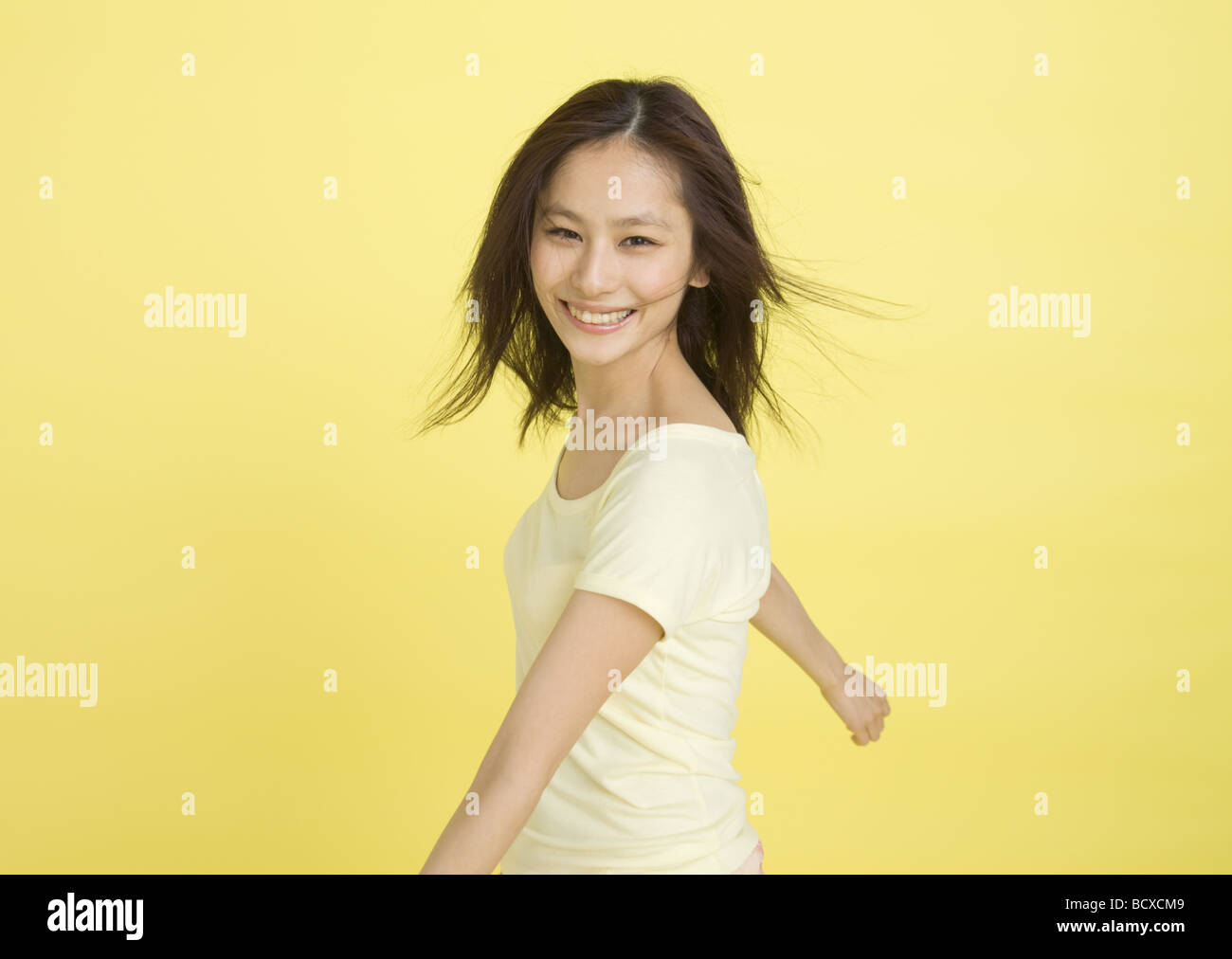 Young woman smiling Stock Photo - Alamy