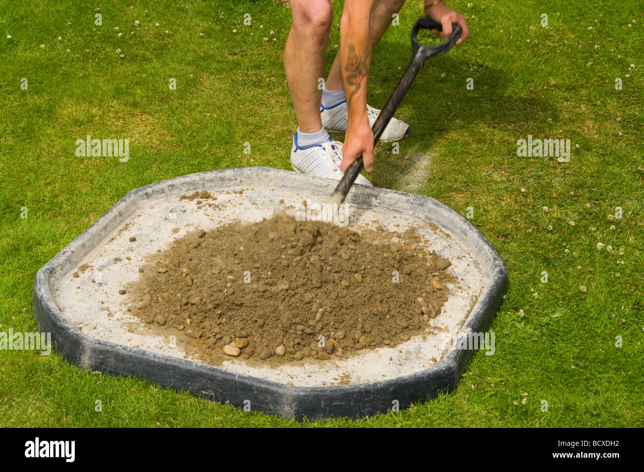 Handyman Mixing Cement and Ballast Stock Photo Alamy