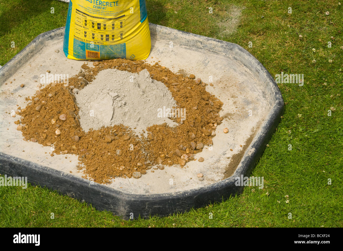 A Bag Of Cement and Ballast On a Mixing Tray Stock Photo Alamy