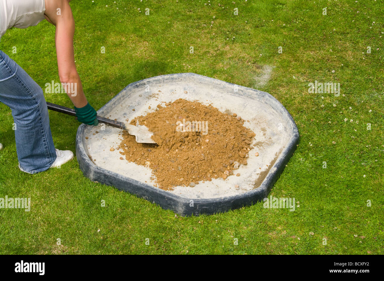 Woman Mixing Cement and Ballast With a Shovel Stock Photo Alamy