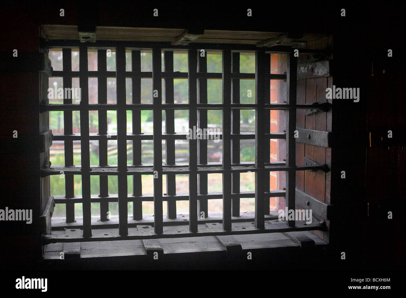 A barred window in the jail at Colonial Williamsburg Virginia Stock Photo