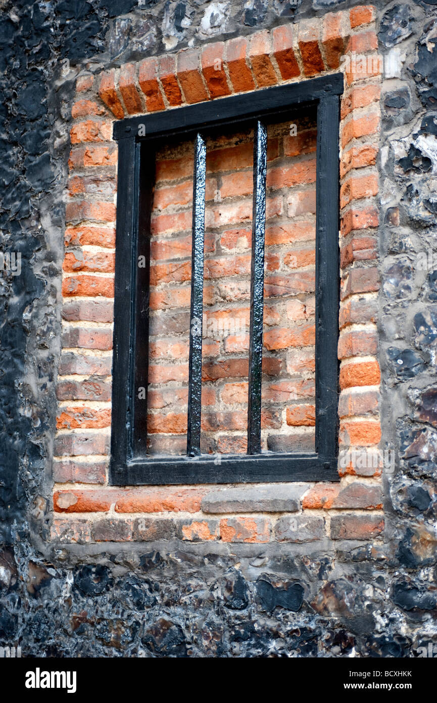 Old window with bars set into a brick & stone wall Stock Photo - Alamy