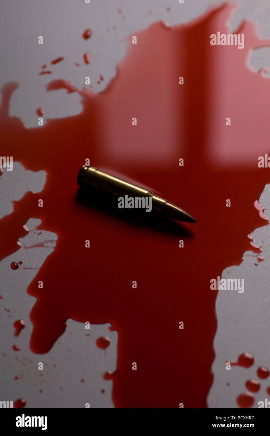Bullet in a pool of blood Stock Photo - Alamy