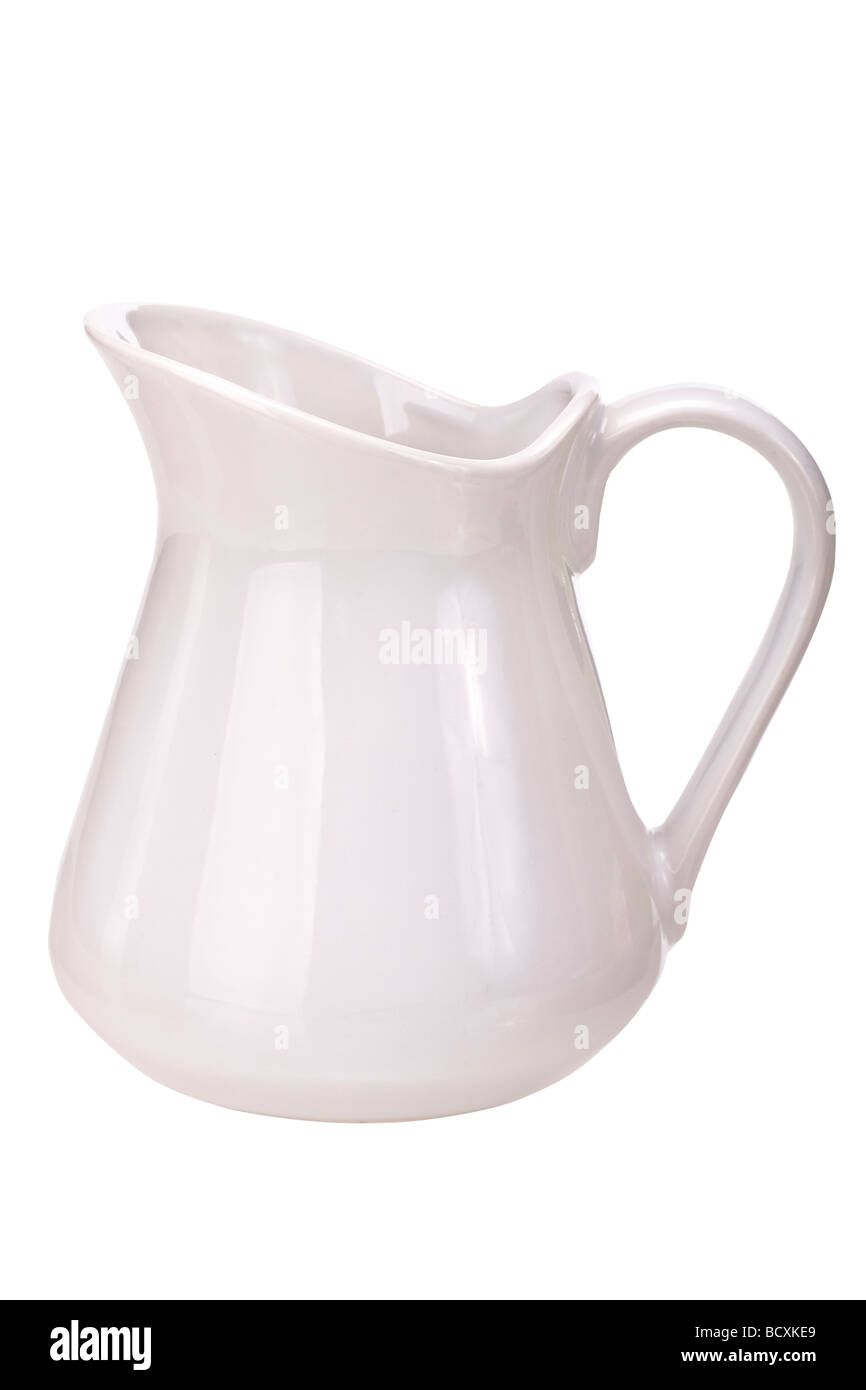 Jug typical for serving milk Isolated on whie background Stock Photo