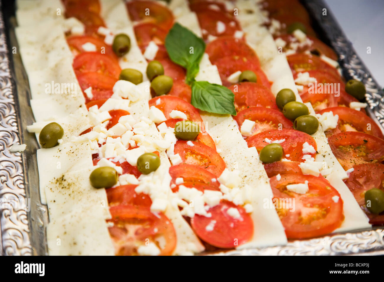 Starter with tomato mozzarella and stuffed olives Stock Photo