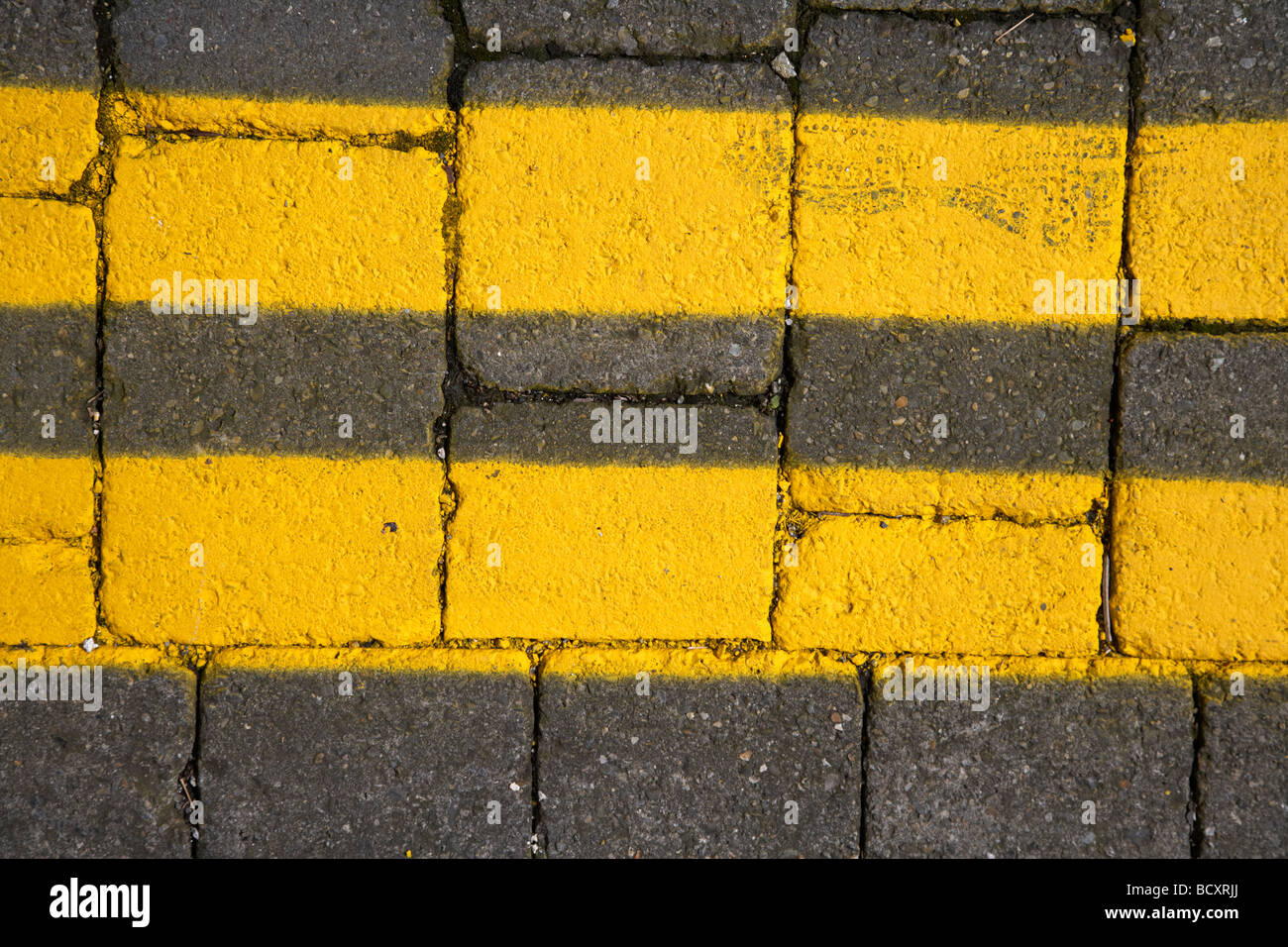 freshly painted double yellow lines on a cobblestone street in dublin