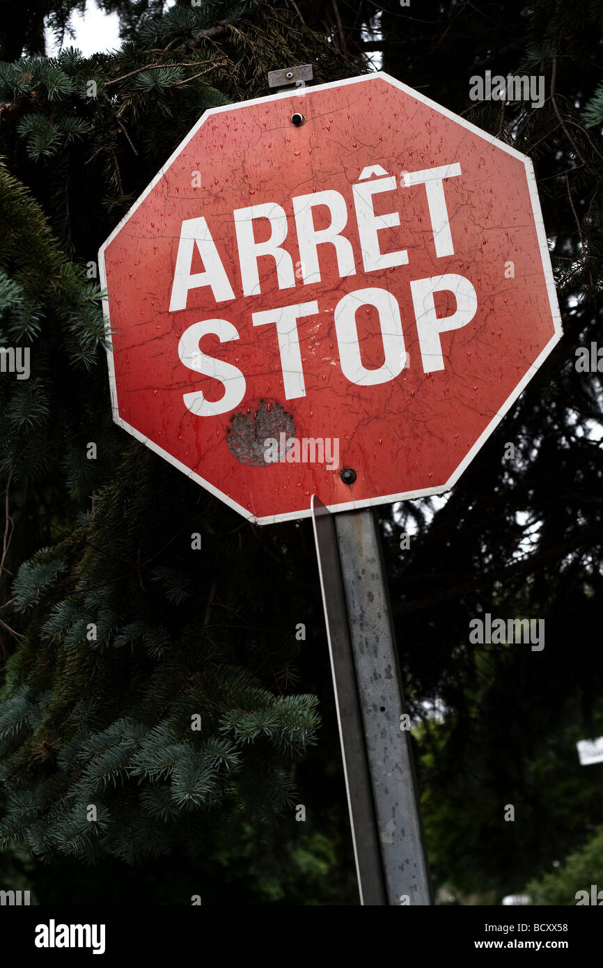 One of the last French English bilingual stop sign is seen on Rue de Berniere street in Quebec city Stock Photo
