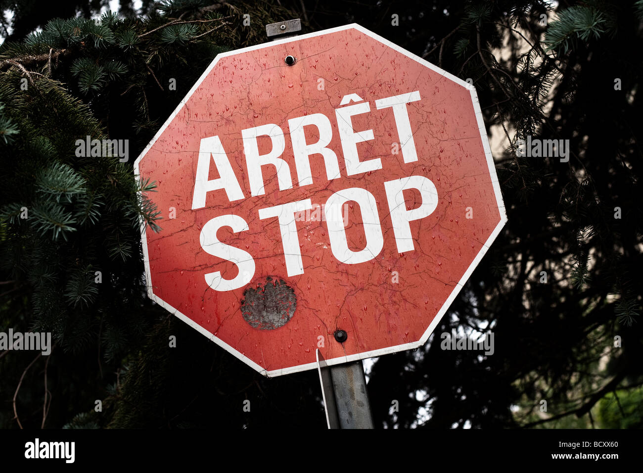 One of the last French English bilingual stop sign is seen on Rue de Berniere street in Quebec city Stock Photo