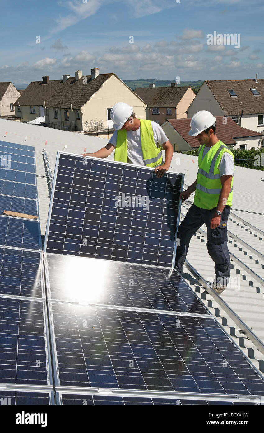2 men Installing photovoltaic cells Stock Photo