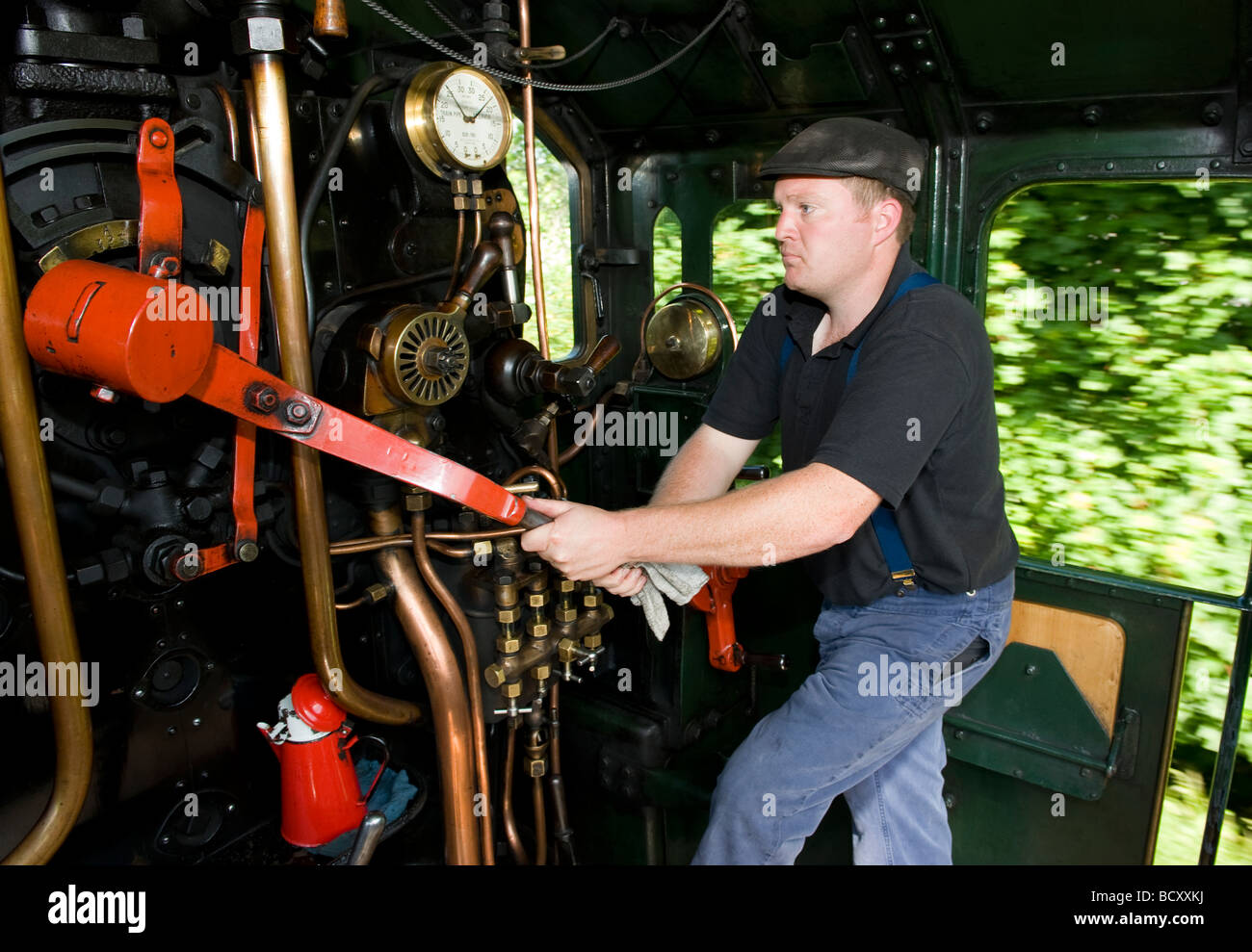 The driver on the footplate of the 'Erlestoke Manor' steam train on The Severn Valley Railway  Worcestershire Stock Photo
