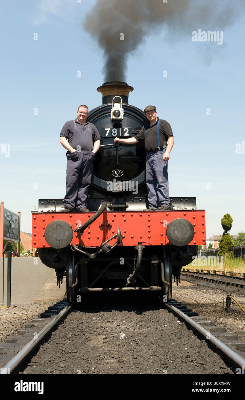 The driver and fireman of  the 'Erlestoke Manor' steam train on The Severn Valley Railway ,Kidderminster Station, Worcestershire Stock Photo