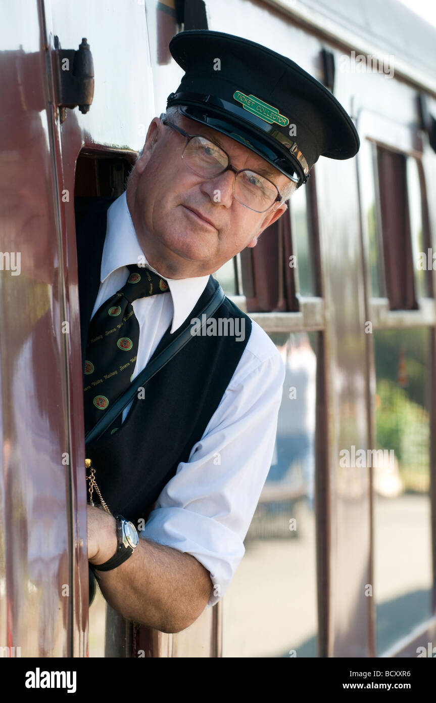The ticket collector on the  'Erlestoke Manor' steam train on The Severn Valley Railway at Kidderminster Station, Worcestershire Stock Photo
