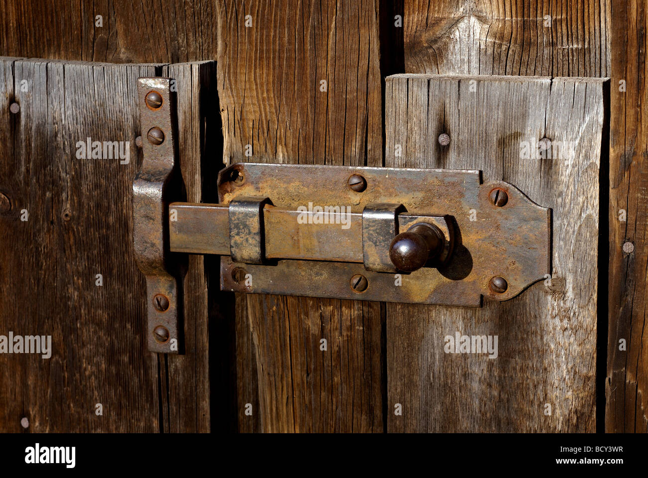Lock on wood door Stock Photo - Alamy
