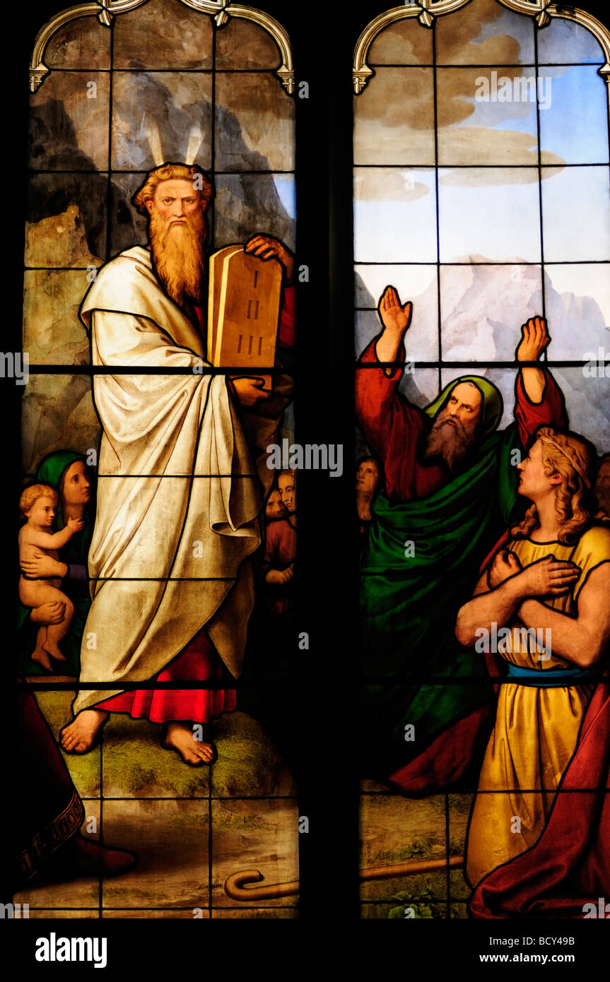 Detail of Stained Glass Window  depicting Moses and the Ten Commandments in Peterhouse College Chapel, Cambridge England UK Stock Photo