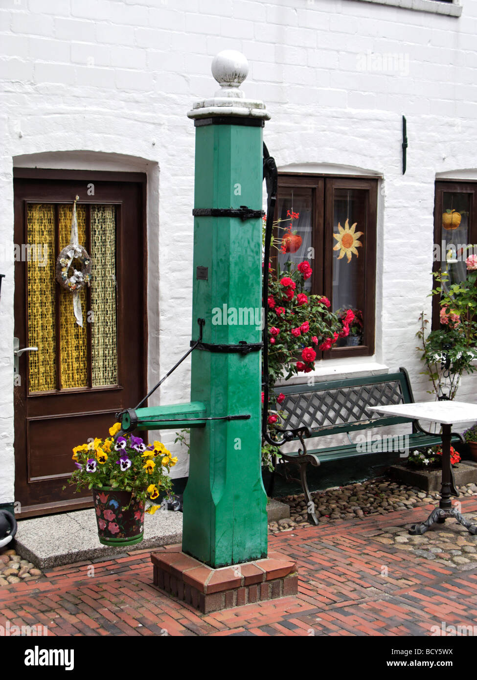 Old Green Wood Water Pump Decoration in the Town of Wyk on the North