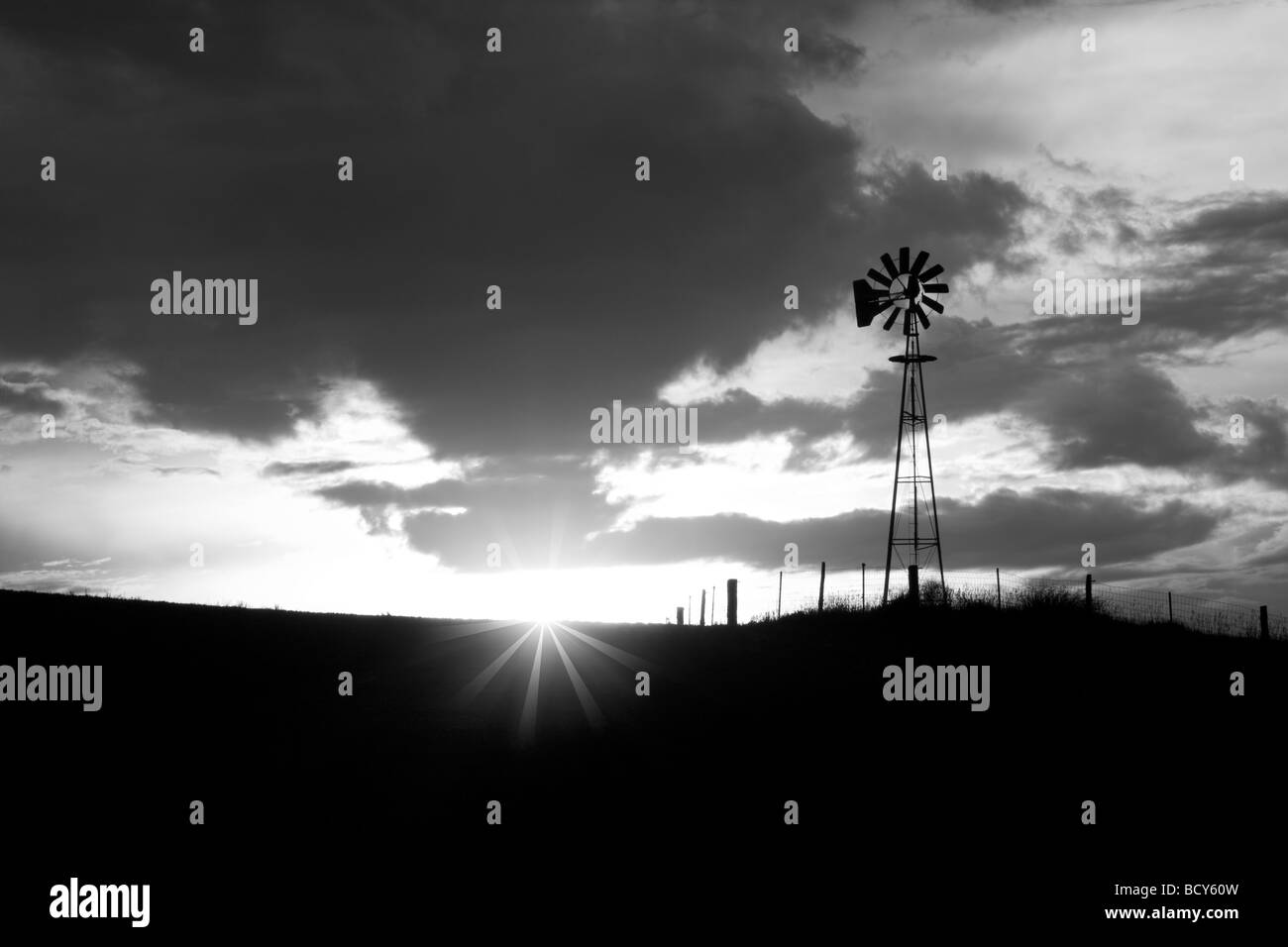 Windmill and thunderstrom at sunset The Palouse Washington Stock Photo