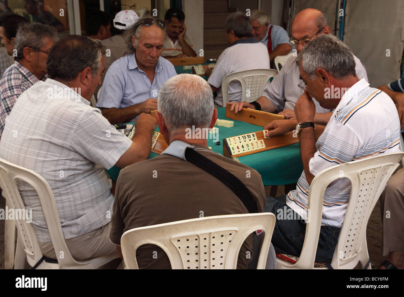 Men playing Okey in a cafe in Yalikavak, Turkey Stock Photo