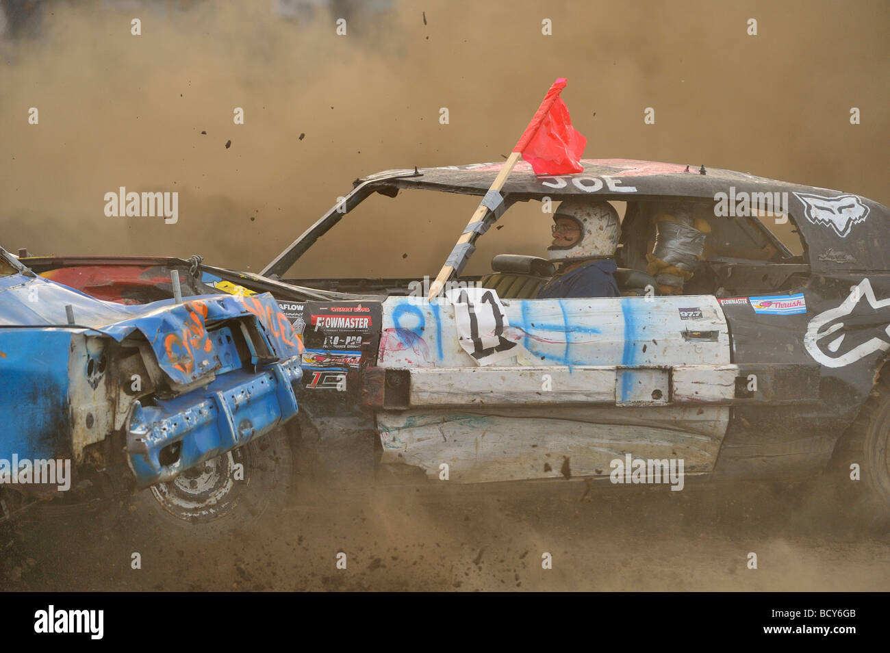 Close up image of a demolition car at a demolition derby on a dusty track in Alberta Canada Stock Photo