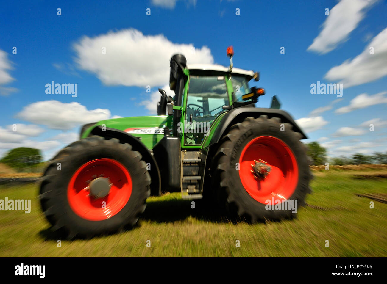 Green farm tractor Stock Photo