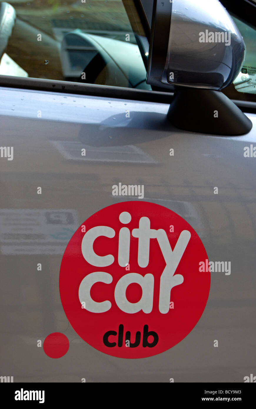 car door with city car club sticker, on a residential street in mortlake, southwest london, england Stock Photo