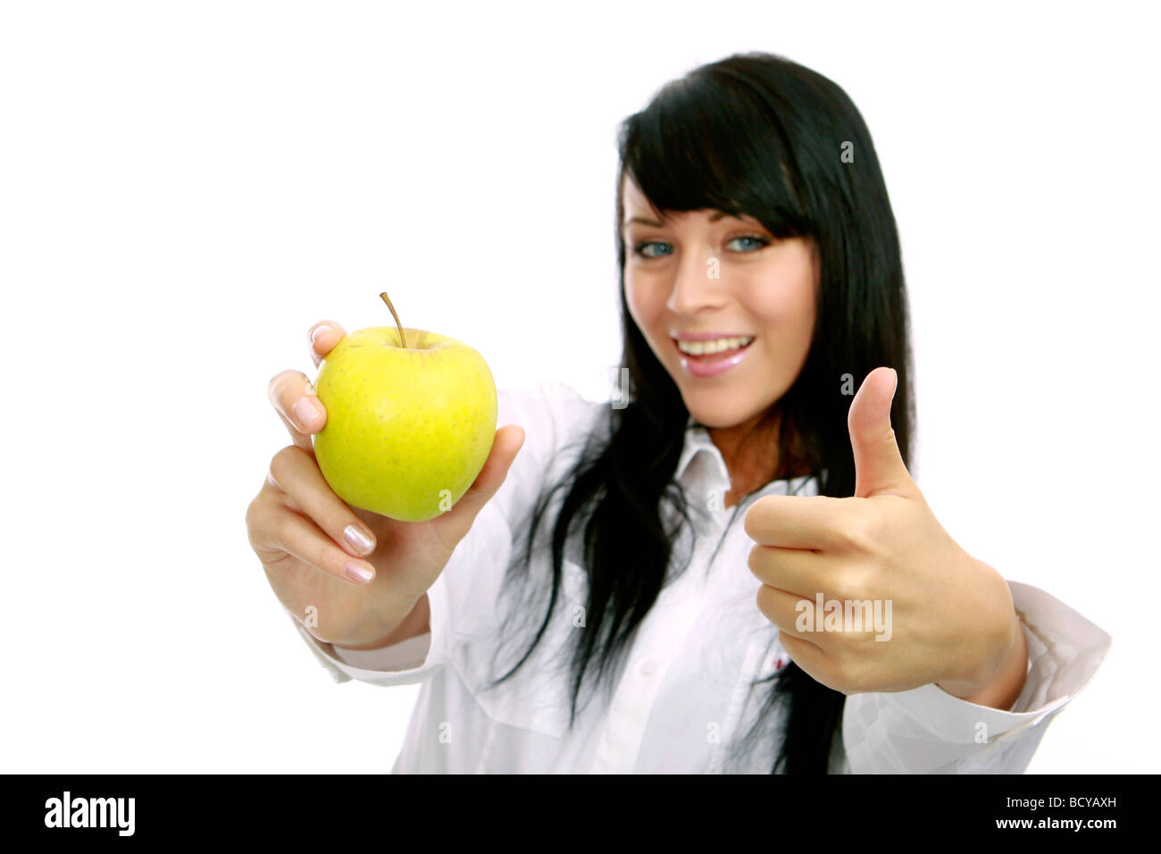 junge Frau mit Apfel girl holding a green apple Stock Photo