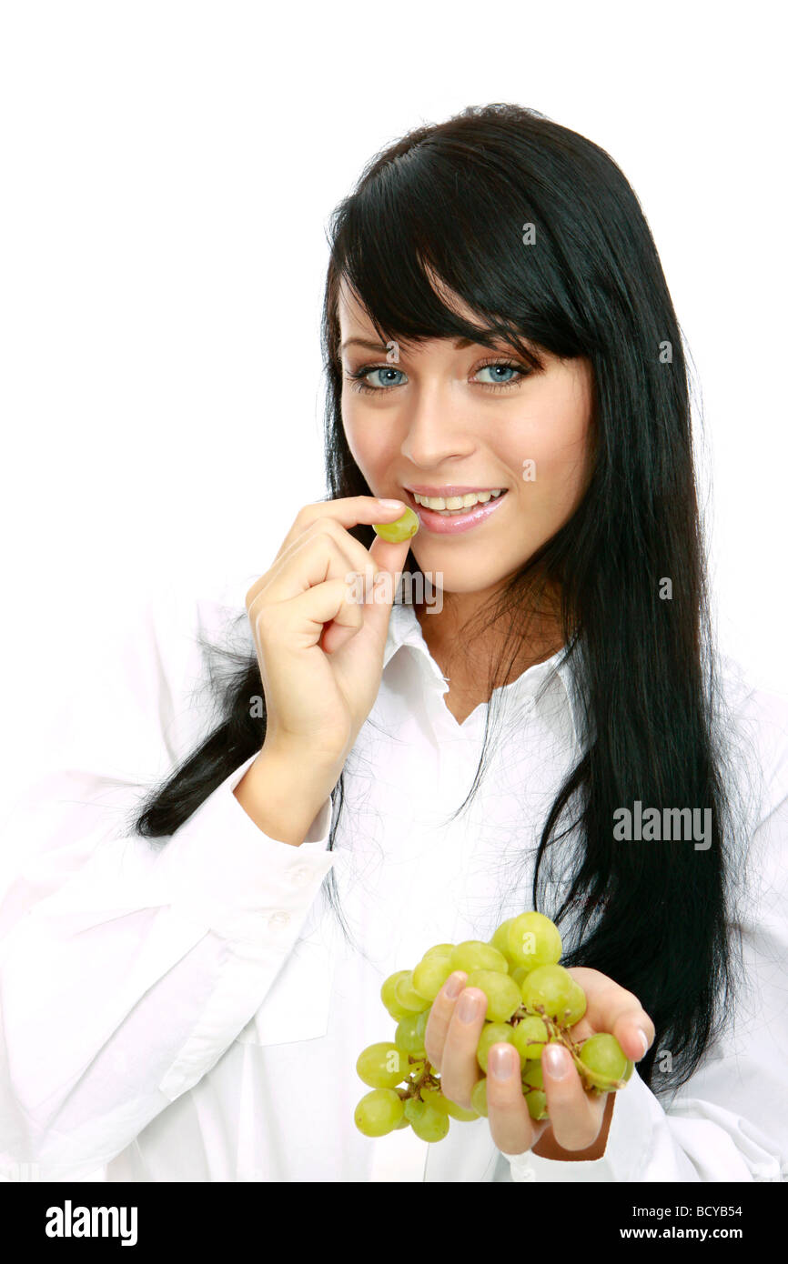Junge Frau isst Weintrauben young woman eats grapes  Stock Photo