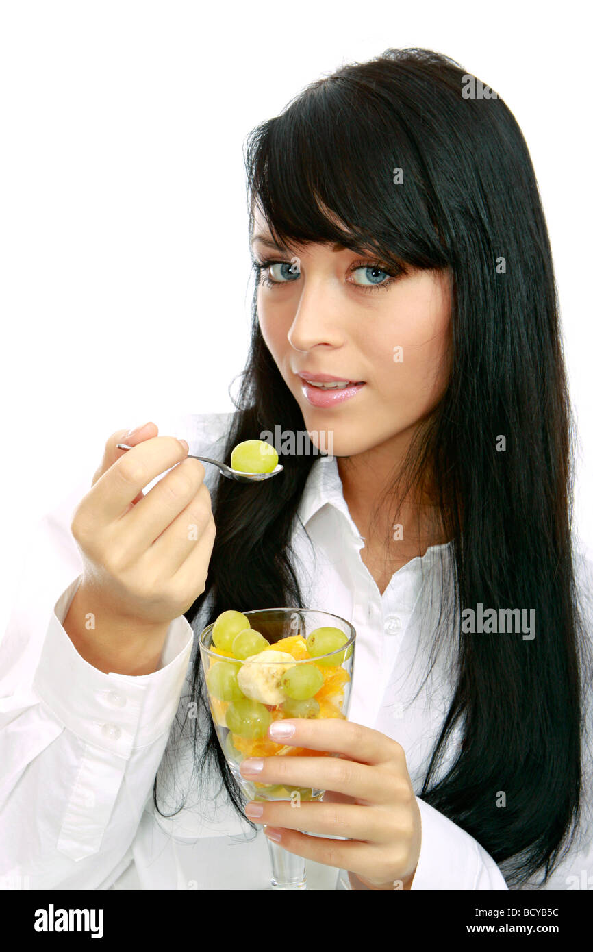 Junge Frau isst Weintrauben young woman eats grapes Stock Photo