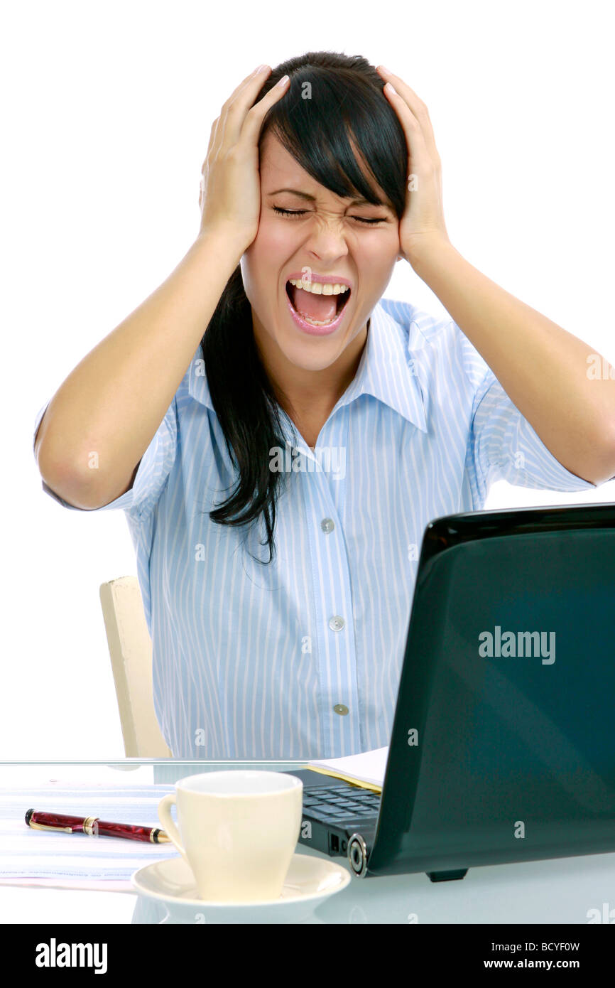 junge gestresste Geschaeftsfrau mit Laptop im Buero frustrated young businesswoman in the office Stock Photo