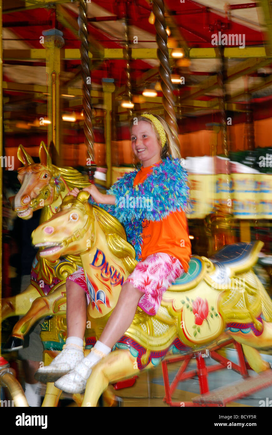 Young girl enjoying fair ground ride, Liphook, Hampshire UK Stock Photo Alamy