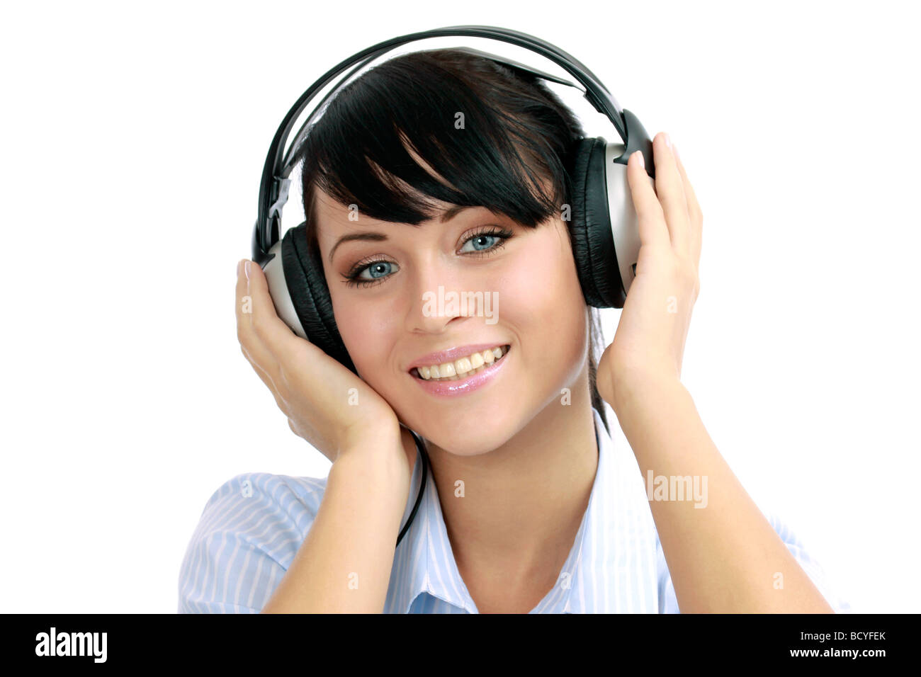 Junge Frau hoert Musik mit Kopfhoerer portrait of a young woman listening to music with headphone Stock Photo