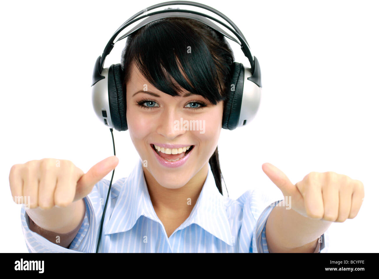 Junge Frau hoert Musik mit Kopfhoerer portrait of a young woman listening to music with headphone Stock Photo