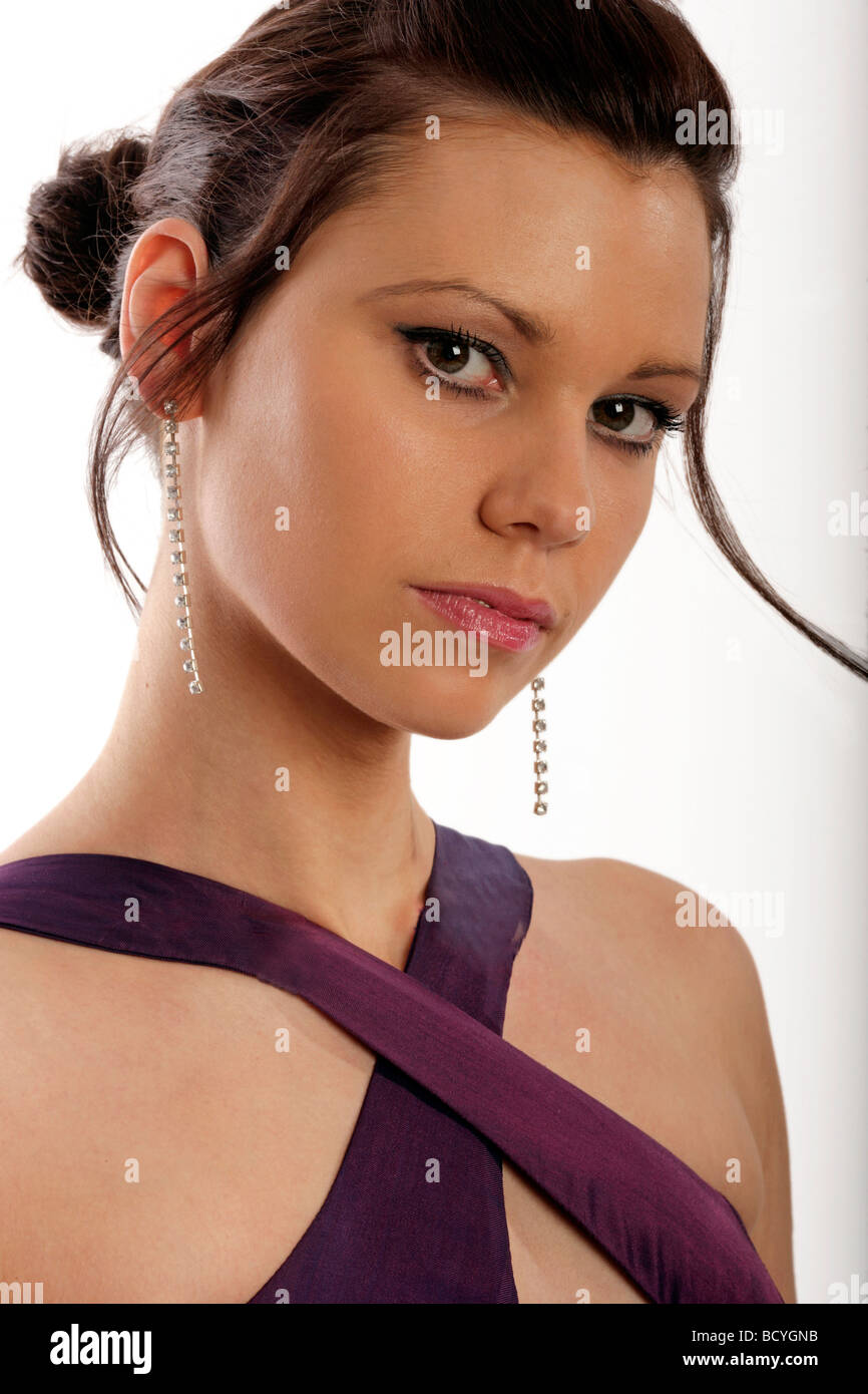 Young Beautiful Brunette Model With Her Hair Up Wearing A Purple Silk