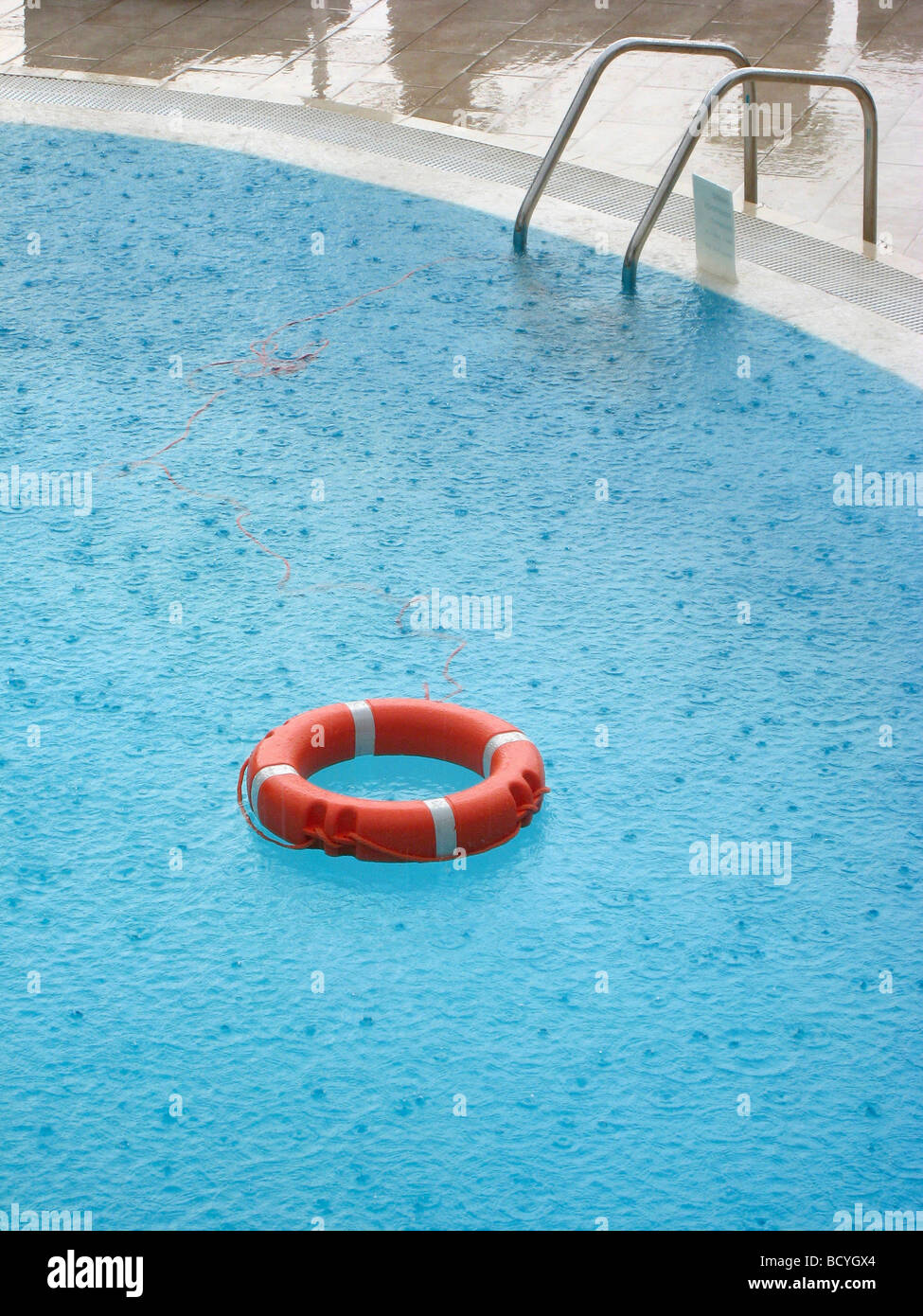 Life ring in a hotel swimming pool Stock Photo