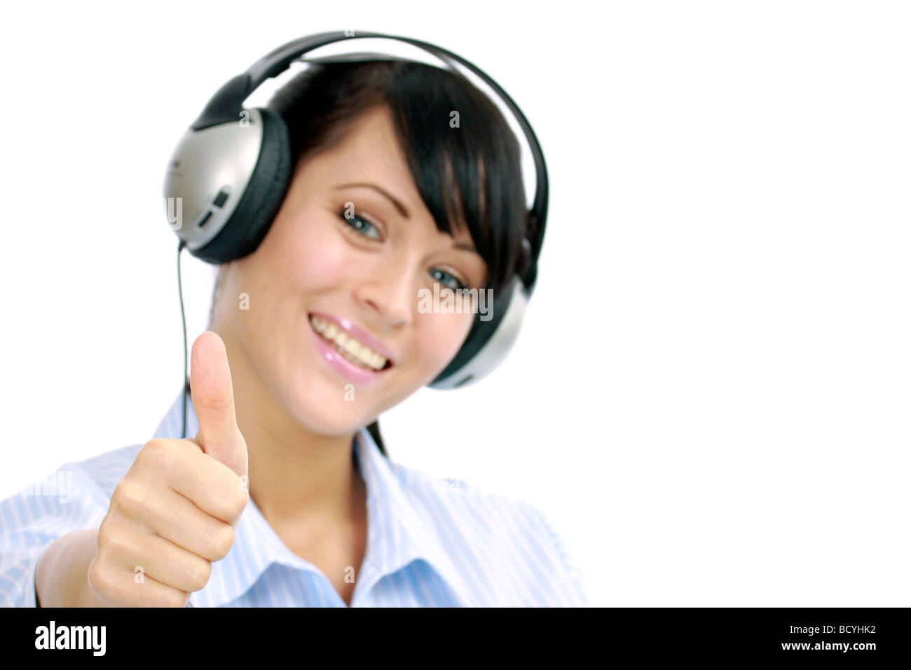 Junge Frau hoert Musik mit Kopfhoerer portrait of a young woman listening to music with headphone Stock Photo