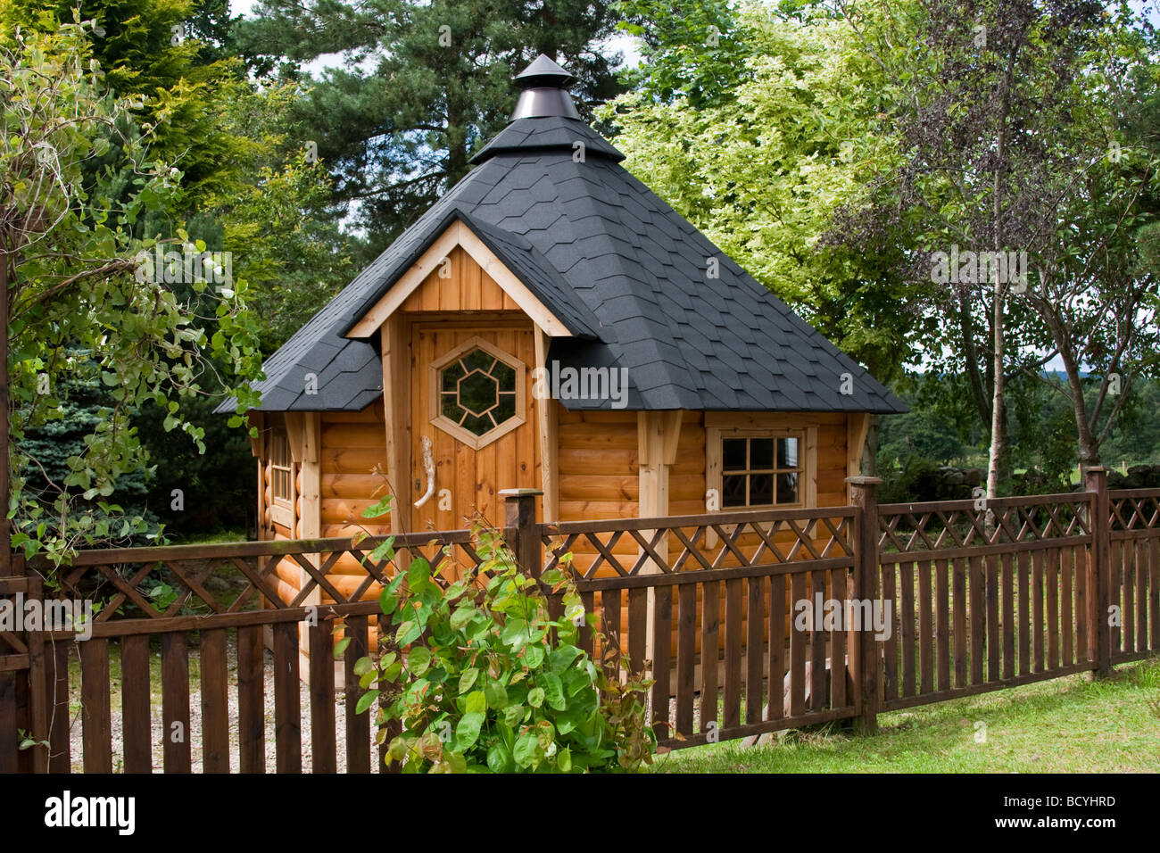 Hexagonal wooden felted Garden shed at Deeside Log Cabins, Aberdeenshire, Scotland, UK Stock Photo