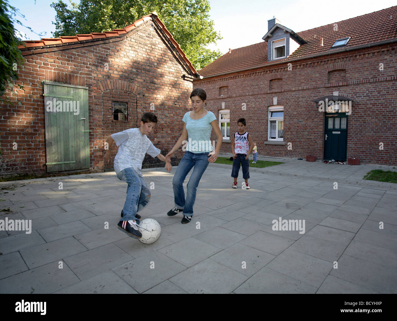 Kids playing soccer in the backyard, Oberhausen, Germany Stock Photo Alamy