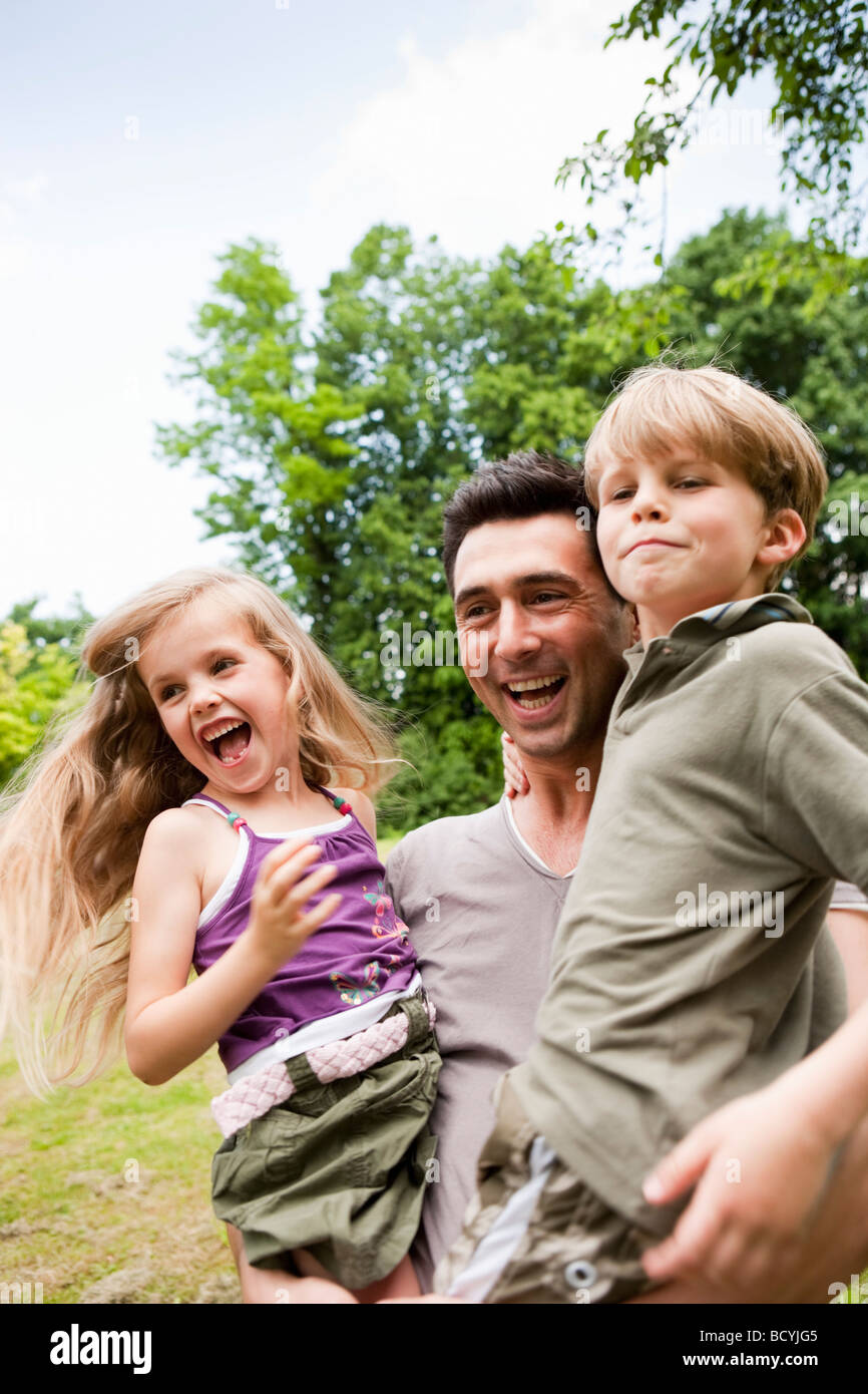 Father with Daughter And Son Stock Photo