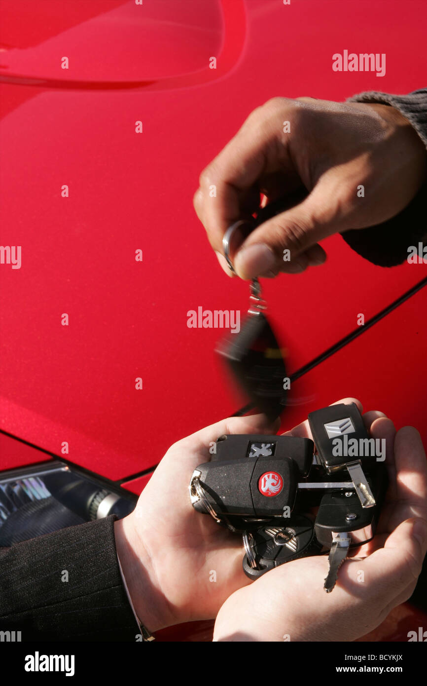 Selection of Car Keys held by businessman Stock Photo Alamy