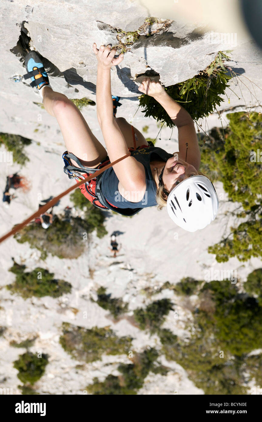 Woman rock climbing Stock Photo - Alamy
