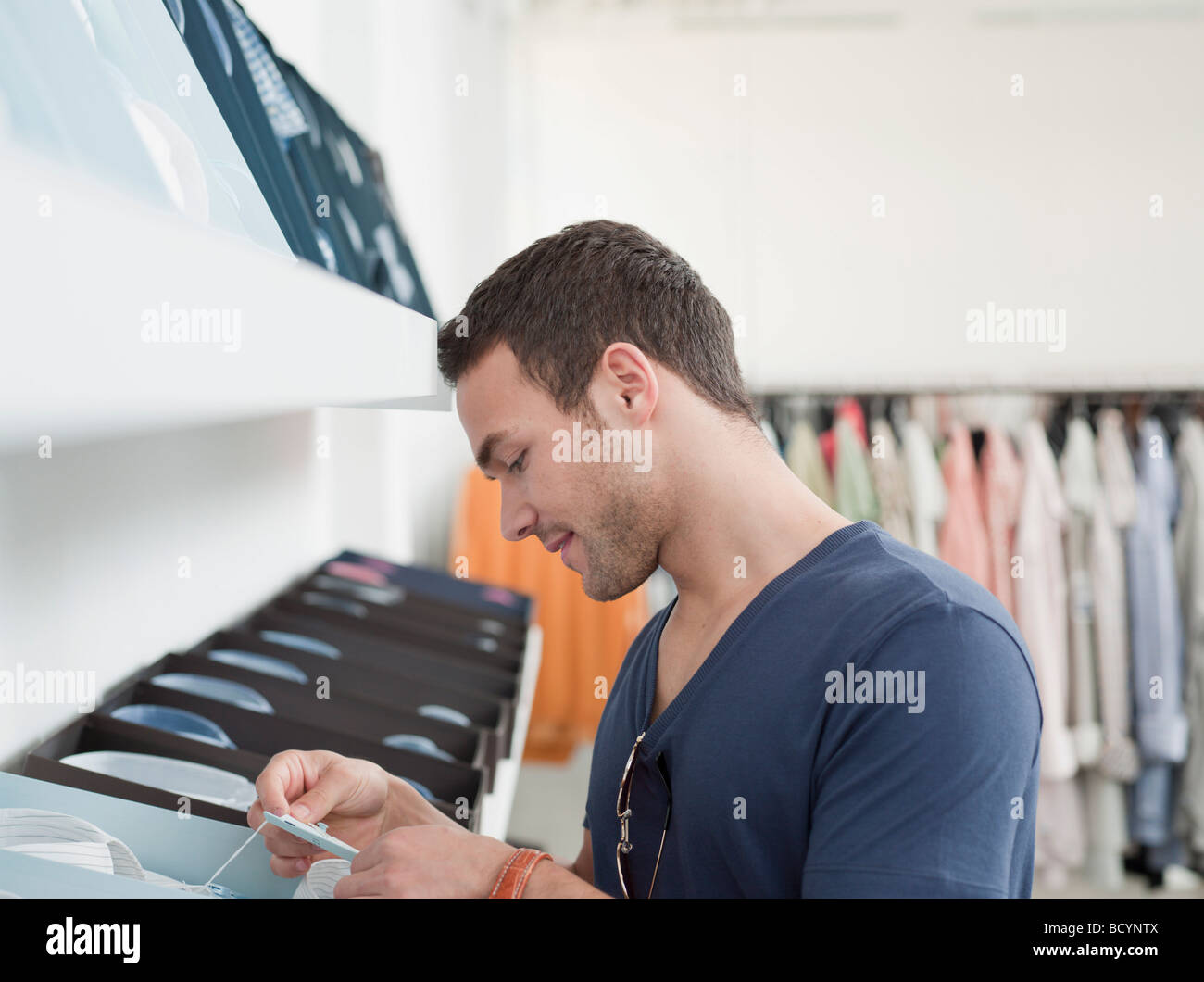 man shopping looking at label Stock Photo
