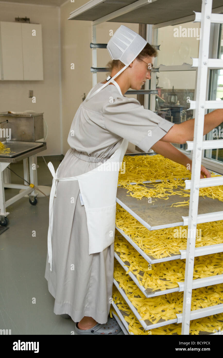 Amish woman making egg noodles in Middlebury Indiana Stock Photo