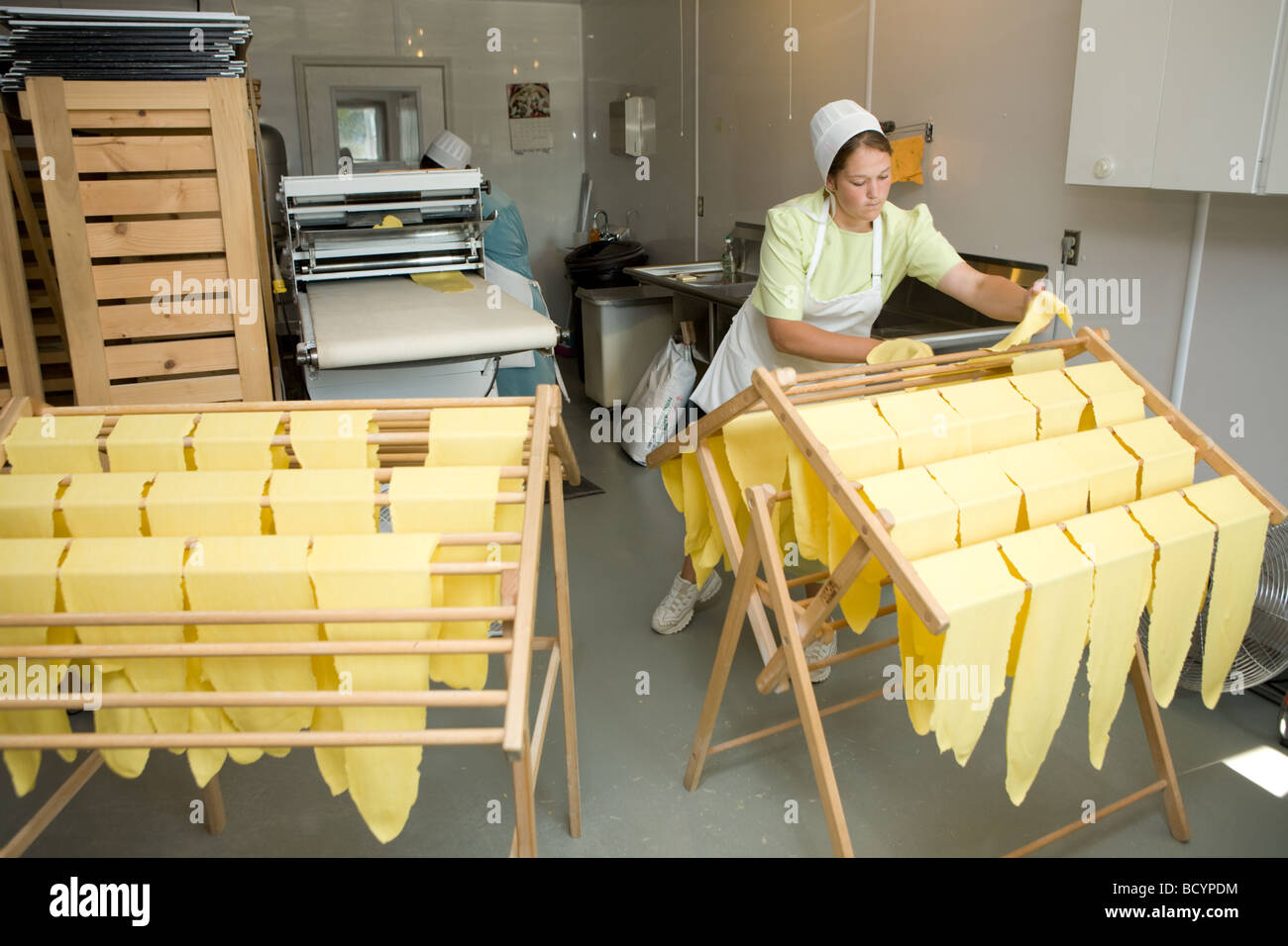 Amish women making egg noodles in Middlebury Indiana Stock Photo