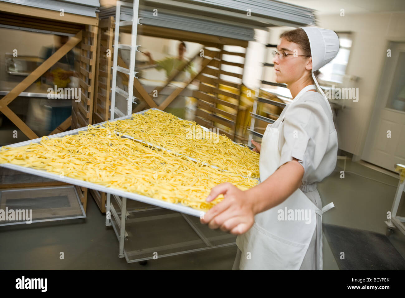 Amish women making egg noodles in Middlebury Indiana Stock Photo