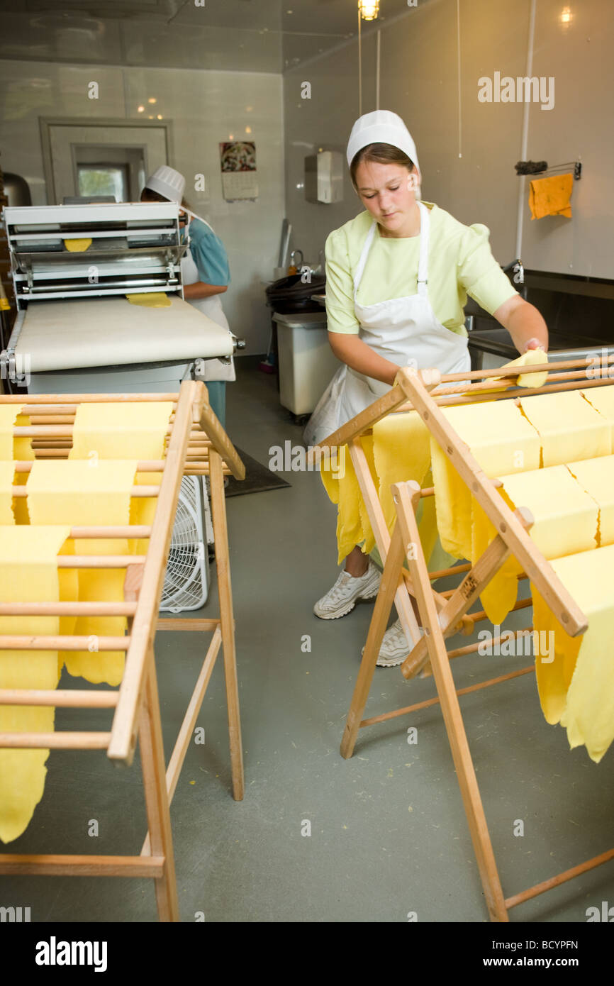 Amish women making egg noodles in Middlebury Indiana Stock Photo