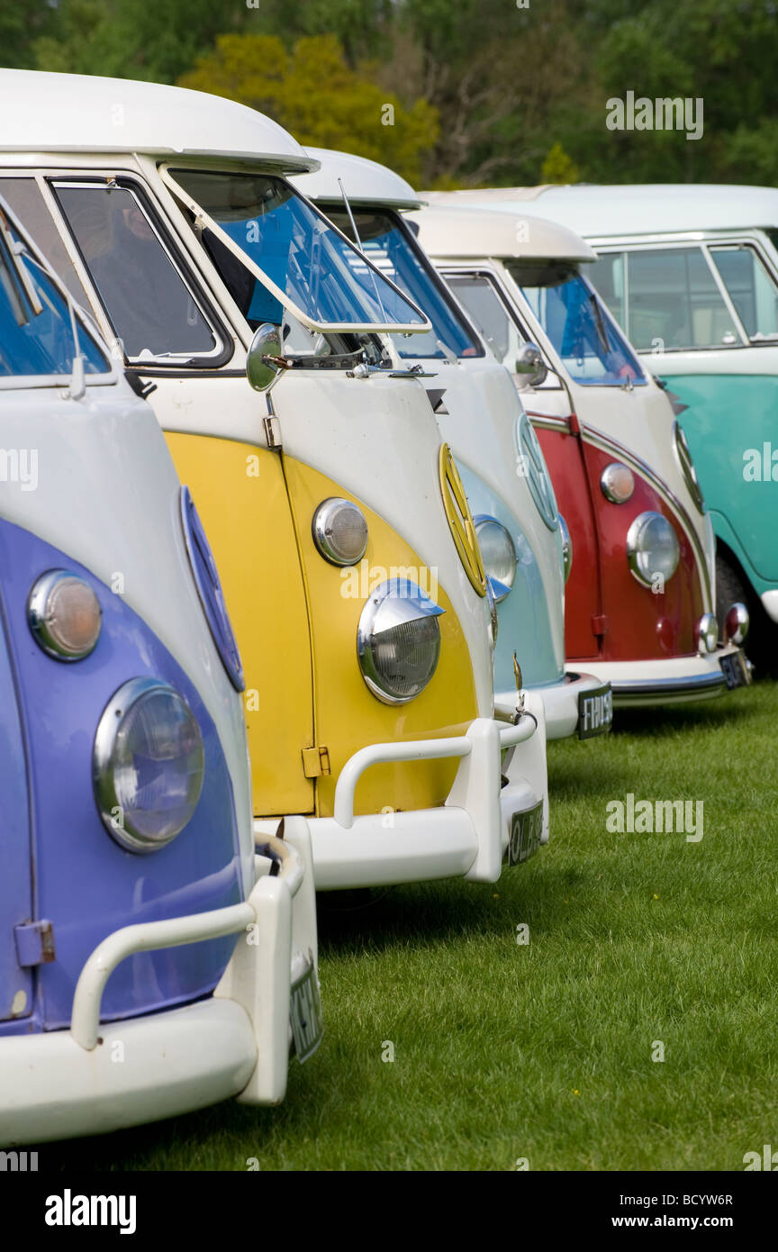 Row of colourful volkswagen camper vans at an enthusiasts rally Stock Photo